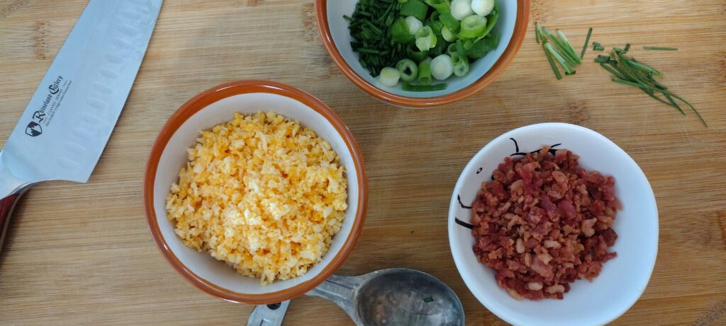 Shredded cheddar, shredded bacon, and chopped green onion.