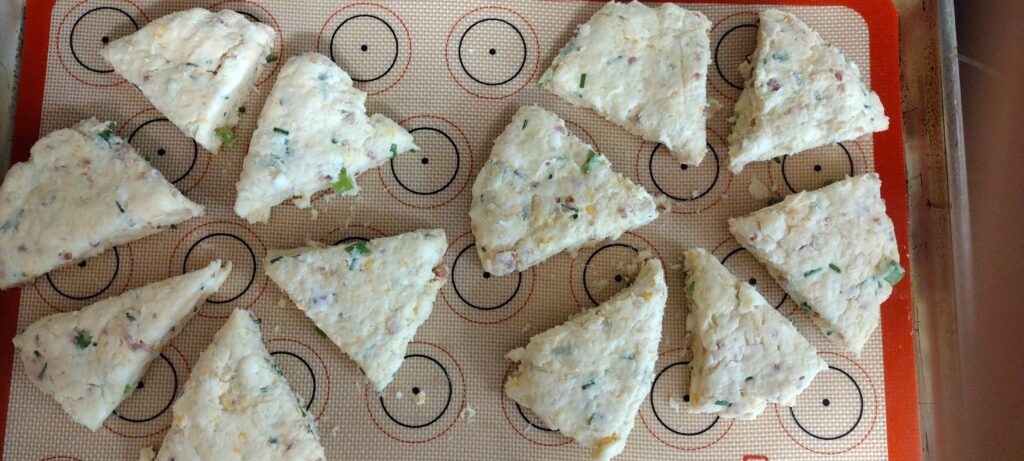 Two six-inch scone dough discs cut into six triangles each.