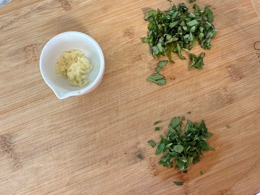 Chopped garlic and chopped basil.