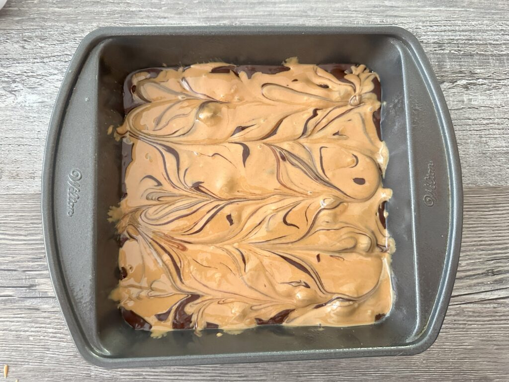 Melted peanut butter swirled into the brownie batter.