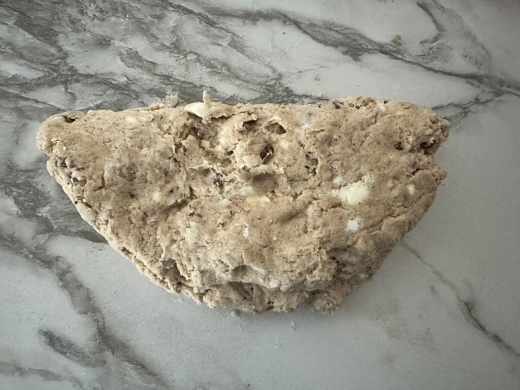 Scone dough flattened and folded for the lamination process.