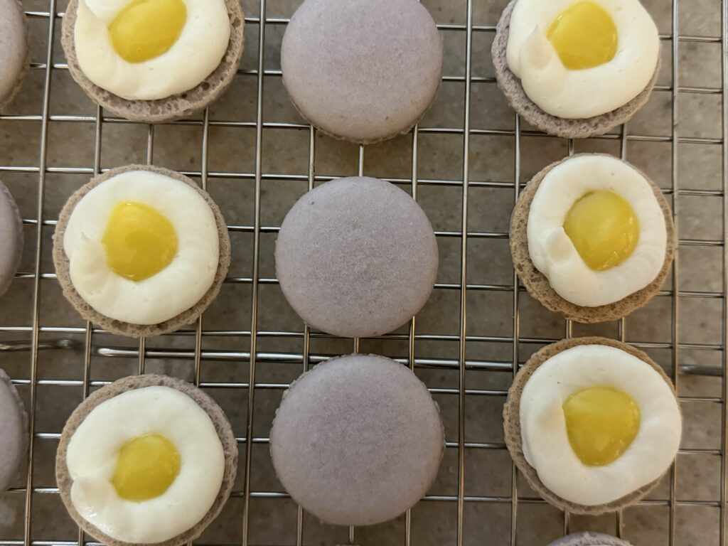 Showing the filling in a few macarons.