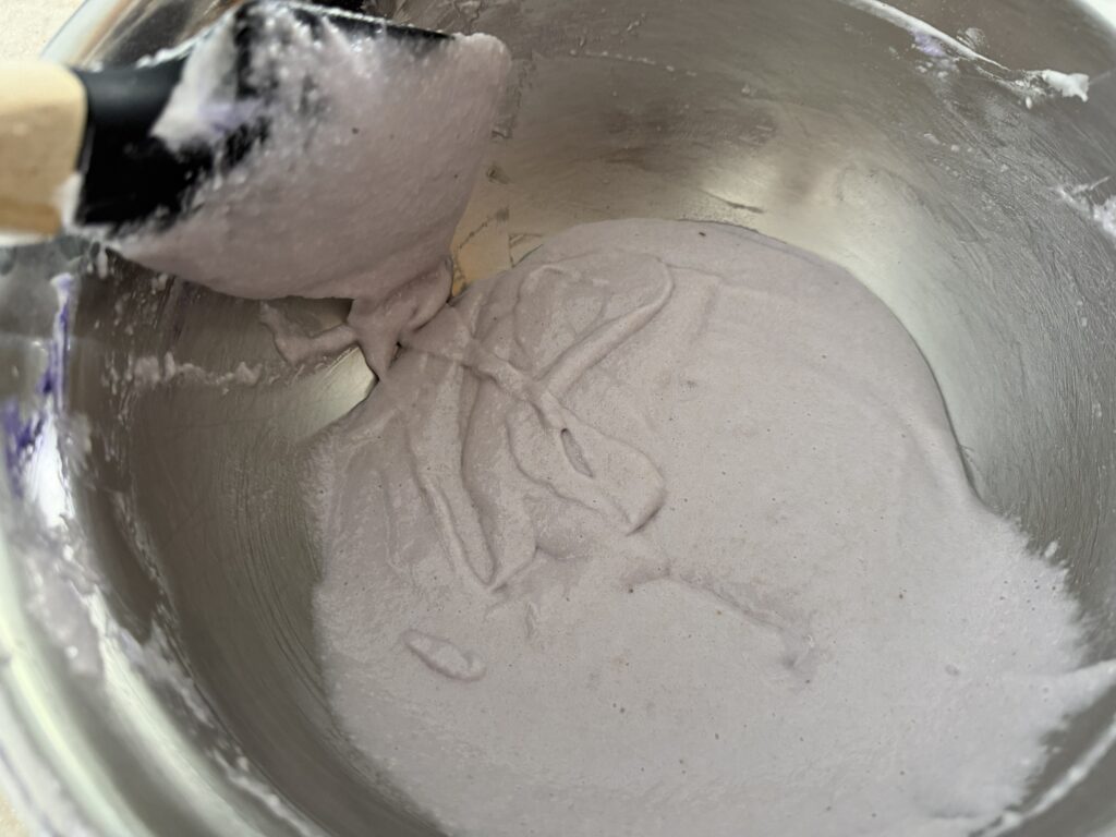 Demonstrating the figure eight test to check if batter is ready.
