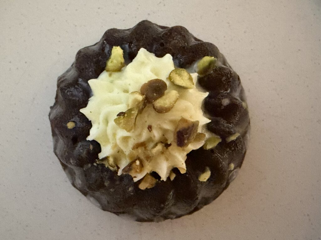 Chocolate mini Bundt cake on a surface.