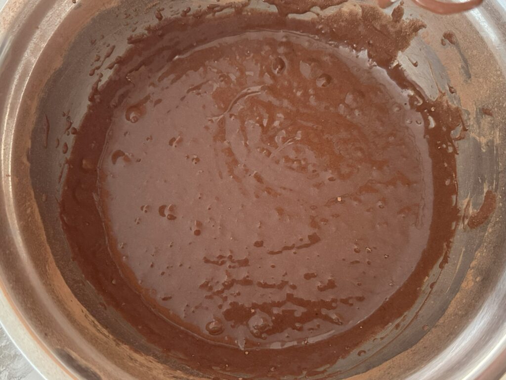 Cocoa powder, oil and butter added into batter.