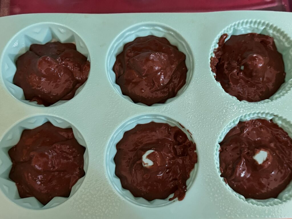 Mini Bundt pan with 6 wells, each well filled 2/3- 3/4 full.