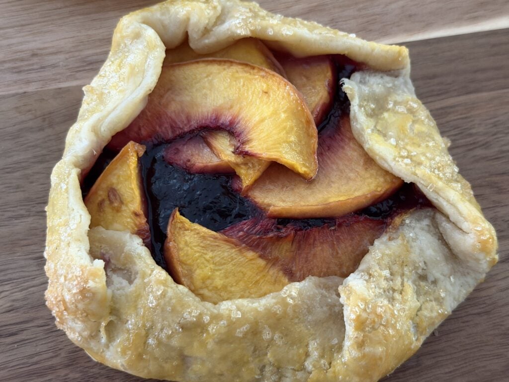 Fully baked peach blueberry mini galette.