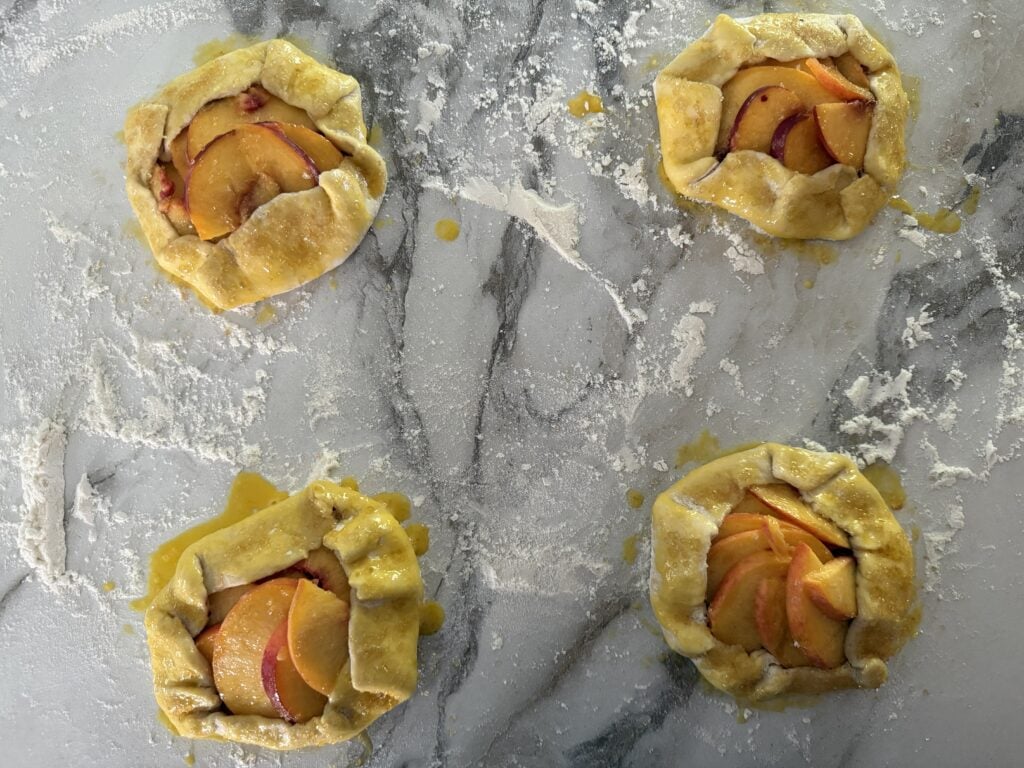 Egg wash and demerara sugar brushed on the crust of the mini galettes before baking.