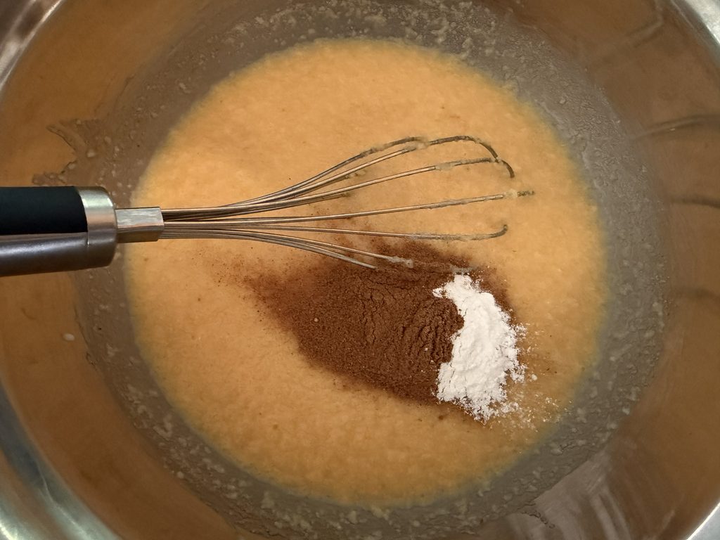 Sour cream, baking soda, baking powder, vanilla, cinnamon, and salt mixed into the batter.