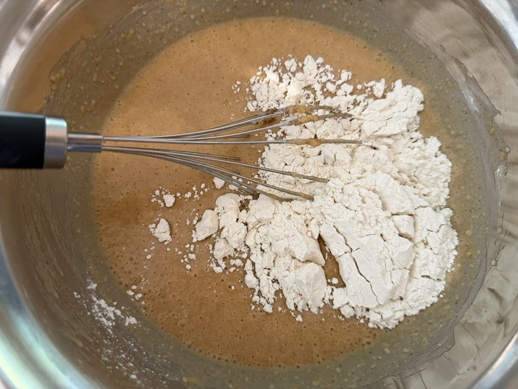 Chopped apple and flour added into the batter.